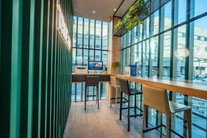 Um restaurante ou outro lugar para comer em Qiuguo Hotel - Beijing Chaoyang Branch