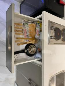 a refrigerator with a bottle of wine in it at Duba gold in Ḑubā +3 photos