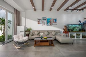 a living room with a couch and a table at Thao Villas Da nang in Da Nang