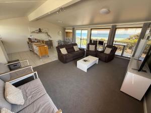 a living room with a view of the ocean at Seastar Moonta in Moonta