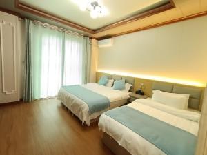 Letto o letti in una camera di Meizhou Cloudy B&B