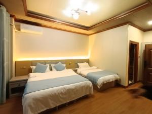 Letto o letti in una camera di Meizhou Cloudy B&B