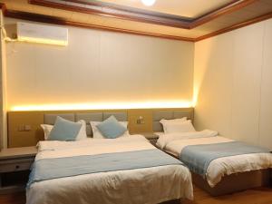 Letto o letti in una camera di Meizhou Cloudy B&B