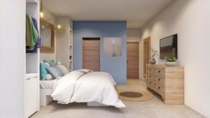 a bedroom with a bed with white sheets and pillows at So KohKoon Beach Resort in Bang Rak Beach