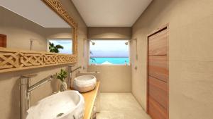 a bathroom with a sink and a large mirror at So KohKoon Beach Resort in Bang Rak Beach
