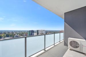 an apartment balcony with a view of the city at Luxury 2B2B in hurstville with Bay & Skyline Views in Sydney