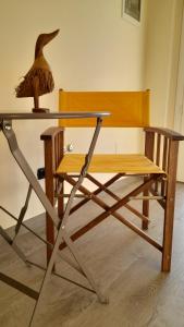 a desk with a chair and a table with a lamp at B&B Casa Pascolone in Pegognaga