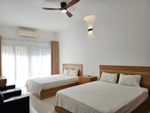 Postel nebo postele na pokoji v ubytování Especen Hotel