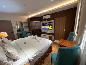 TV a/nebo společenská místnost v ubytování DM Residente Hotel Inns & Villas
