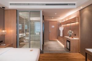 Postel nebo postele na pokoji v ubytování Yunjian Hotel