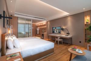 Postel nebo postele na pokoji v ubytování Yunjian Hotel