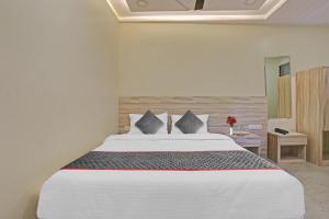 Postel nebo postele na pokoji v ubytování Hotel O Kiwi International