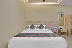 Postel nebo postele na pokoji v ubytování Hotel O Kiwi International