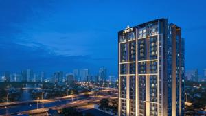 a tall building with a sign on top of it at RESidenza Condonium - D1mension & Zenity Tower, SG's Heart & Gym, Pool in Ho Chi Minh City