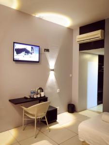 TV a/nebo společenská místnost v ubytování De Choice Hotel Tawau