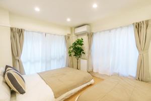 Letto o letti in una camera di 120Tb 楓屋2F 楓屋アネックス 67m貸切 三田線志村坂上駅徒歩10分東京タワー直通キッズスペースリノベ