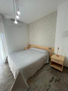 A bed or beds in a room at B&B Villa Marinetti