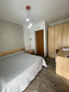 A bed or beds in a room at B&B Villa Marinetti