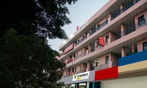 a hotel building with a sign on the side of it at Hotel King Palace Near CP 67 Mall Airport Road Mohali in Sohāna