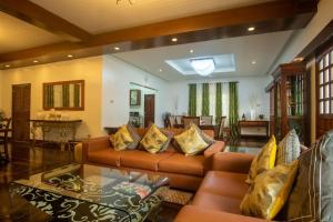 a living room with a couch and a table at Casa Nostalgia in Manila