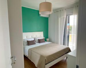 Postel nebo postele na pokoji v ubytování B&B e Apartment MARIA VITTORIA - Anzio Blue Horizon - 150 mt dal mare