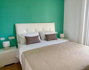 Postel nebo postele na pokoji v ubytování B&B e Apartment MARIA VITTORIA - Anzio Blue Horizon - 150 mt dal mare