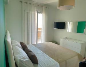 Postel nebo postele na pokoji v ubytování B&B e Apartment MARIA VITTORIA - Anzio Blue Horizon - 150 mt dal mare