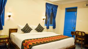 Voodi või voodid majutusasutuse Ibex Resorts, Coimbatore Kakarla toas