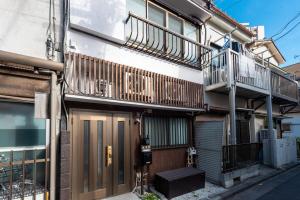 a building with balconies on the side of it at Y's INN Ikebukuro 013T in Tokyo
