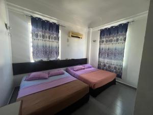 Voodi või voodid majutusasutuse Dung Fang Hotel toas