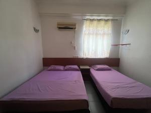 Voodi või voodid majutusasutuse Dung Fang Hotel toas