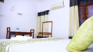 Katil atau katil-katil dalam bilik di Hotel Planet Residency