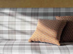 a bed with two pillows on top of it at Loisir Hotel Kyoto Toji in Kyoto
