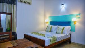 Katil atau katil-katil dalam bilik di Hotel Planet Residency