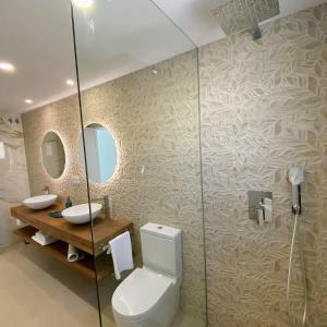 a bathroom with a toilet and a sink and a mirror at MAR y CALMA NG in Benicarló +20 photos
