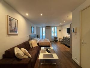 a living room with a couch and a table at Verginia in Cannes