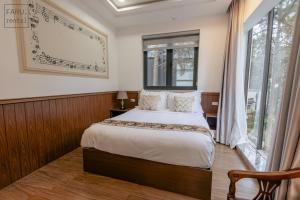 Postel nebo postele na pokoji v ubytování Faru Pine Woods Villa