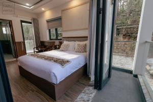 Postel nebo postele na pokoji v ubytování Faru Pine Woods Villa