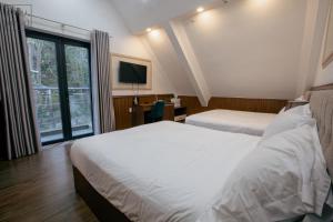 Postel nebo postele na pokoji v ubytování Faru Pine Woods Villa