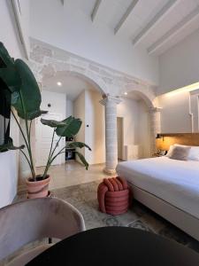 Postel nebo postele na pokoji v ubytování Palazzo Matà Boutique Hotel