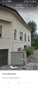 a picture of a white building with a gate at Venice Miramare Residence 2 in Zelo