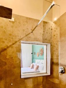 a bathroom with a picture of a bed in a shower at Palazzo Matà Boutique Hotel in Taranto +85 photos