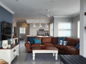 a living room with a couch and a table at Frinton on Sea 12 in Ballito