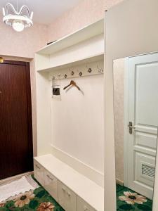 a bathroom with white walls and a white closet at Ub Friends Guest House in Ulaanbaatar