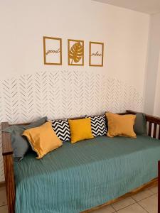 a couch with pillows on it in a room at Departamento Inigualable en Ciudad de Mendoza in Barraquero