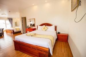 Ένα ή περισσότερα κρεβάτια σε δωμάτιο στο Thanh Do Hotel