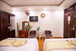 Ένα ή περισσότερα κρεβάτια σε δωμάτιο στο Thanh Do Hotel