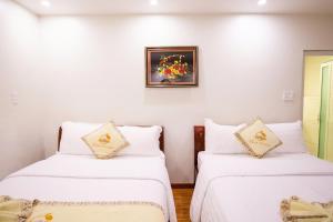 Ένα ή περισσότερα κρεβάτια σε δωμάτιο στο Thanh Do Hotel