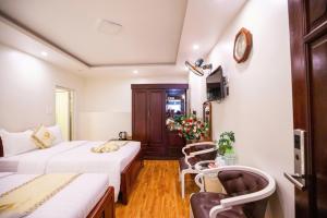 Ένα ή περισσότερα κρεβάτια σε δωμάτιο στο Thanh Do Hotel