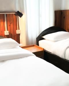 Postel nebo postele na pokoji v ubytování Xanadu Homes